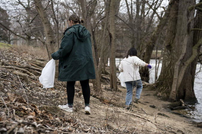 MSU Fisheries and Wildlife Club, MSU Outdoors Club clean up the banks of the Red Cedar